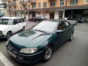 Opel Omega sedan - Kuzov: 4 qapılı sedan, tünd-yaşıl rəng - Mühərrik
