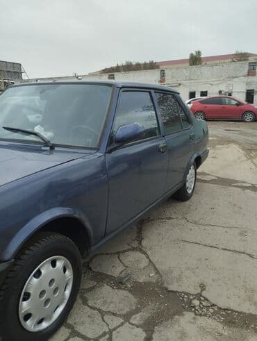 taksi maşınları: Model: Tofas Şahin/Doğan sedan (mavi rəng) Kuzov: 4 qapılı, klassik — 6