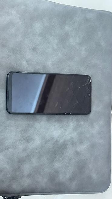 skan: Xiaomi Redmi smartfon - Model: Redmi (arka qapaqda “Redimi” loqosu) - — 2