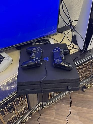PlayStation 4 Pro oyun konsulu Komplekt: - PS4 Pro konsolu - 4 ədəd