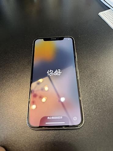 a 7: IPhone X, Gümüşü — 1