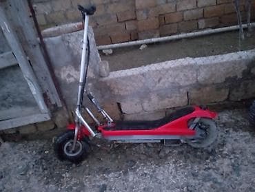 electro gitara: Elektrik skuter – şinləri iri ölçülü, möhkəm metal çərçivəli model — 2