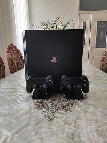 Ps4 Pro 1TB. Original pultnan 2 ədəd. Üstündə sərinləndirici stand-i — 1