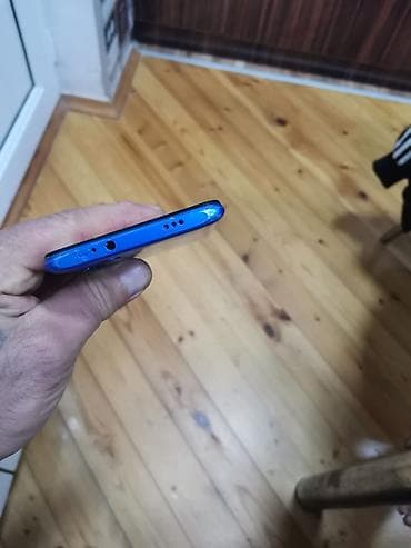 herbi telefon: Mavi rəngli smartfon - Ekran: ön hissədə damla tipli ön kamera kəsiyi — 2