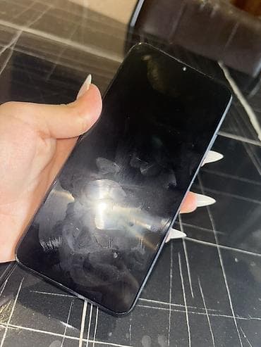 smart tv: Xiaomi Redmi T9 smartfon - Model: Redmi (arka qapaqda “Redmi” loqosu) — 1