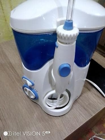 şirin su aparati: Stasionar ağız duşu (irrigator) - Su çəni: iri həcimli, mavi şəffaf — 2