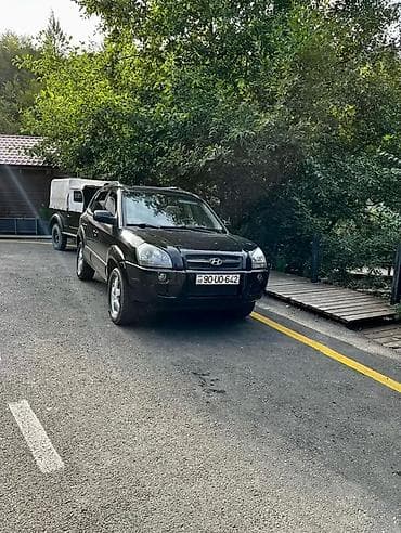 kia rio manitor: Hyundai Tucson: 2 l | 2005 il Ofrouder/SUV — 2