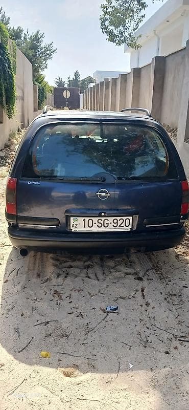 Opel: Opel Astra F Caravan (universal), tünd mavi rəng. - Kuzov: universal — 3
