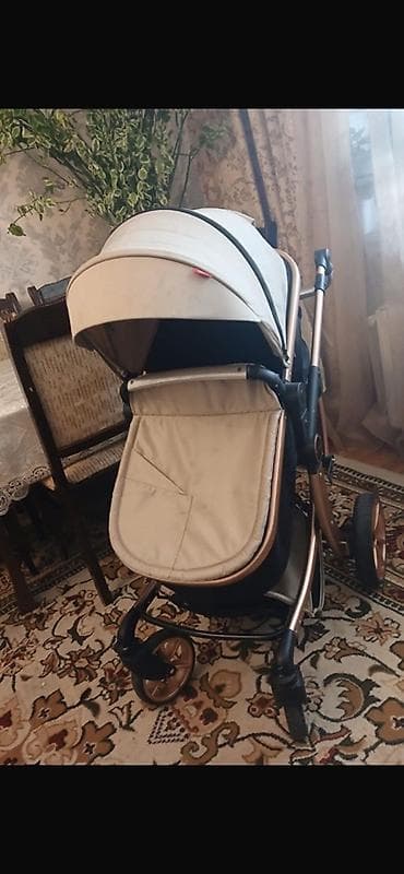 labubu nece manatdir: Uşaq arabası – bej rəngli, qızılı/bronza çərçivə ilə Xüsusiyyətlər: - — 1