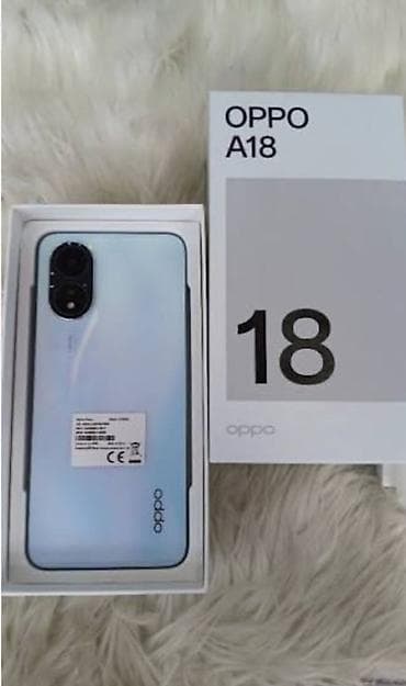 Fly: Oppo A18, 128 ГБ, цвет - Голубой, Face ID — 1
