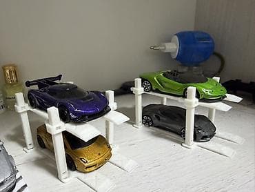 Стендовые витрины: Məhsul: Miniatür avtomobil saxlanma liftləri (2 mərtəbəli) Təsvir: - — 1