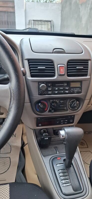 osram lampaları: Nissan Sunny sedan – geniş salonlu, komfortlu şəhər və uzun yol — 10