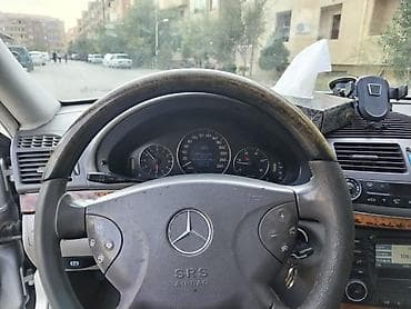 2000 bmw 320i: Mercedes-Benz E-Class: 2.7 l | 2002 il Sedan — 7