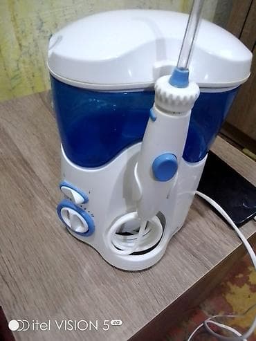 şirin su aparati: Stasionar ağız duşu (irrigator) - Su çəni: iri həcimli, mavi şəffaf — 3