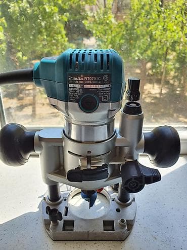 mini drel satilir: Makita RT0701CX7 elektrik əl frezeri – 2 baza və aksesuarlarla — 1