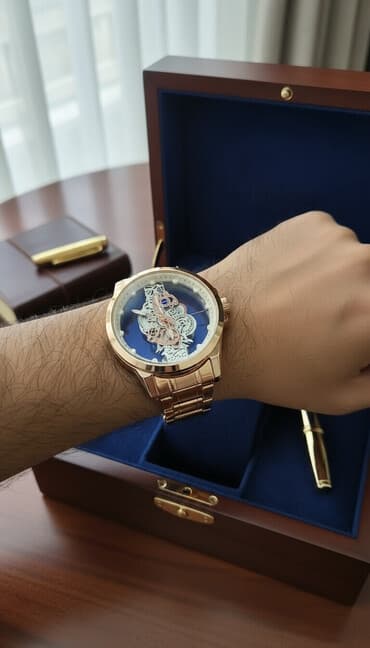 saat gumuş: Kişi qol saatı - Korpus və qolbaq: paslanmayan poladdan, qızılı rəng — 1