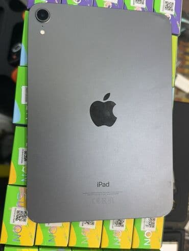 ipad зарядка: Bu, arxa tərəfində "iPad" yazısı və Apple loqosu olan boz rəngli — 1