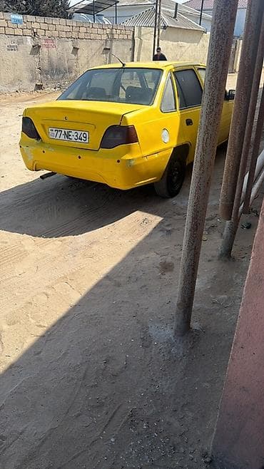 ferrari satilir: Model: Daewoo Nexia (sedan) Rəng: sarı Kuzov: 4 qapılı, ön və arxa — 3