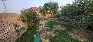Çox TƏCİLİ ƏLİMYANDI SATILIRHasarlı daş hasarla əhatələnmiş həyət