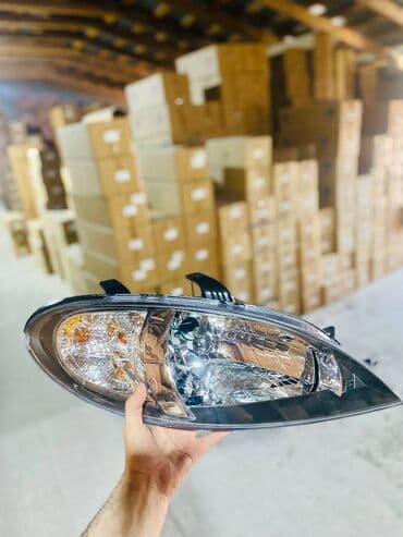 şevralet kruz: Daewoo Gentra 2014 qabaq fara . Chevrolet Lacetti 2015 on sag ( sağ ) — 1