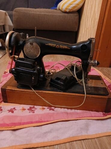 paltar tikən masin: Elektriklə işləyən klassik tikiş maşını - Korpus: metal, qara rəngli — 1