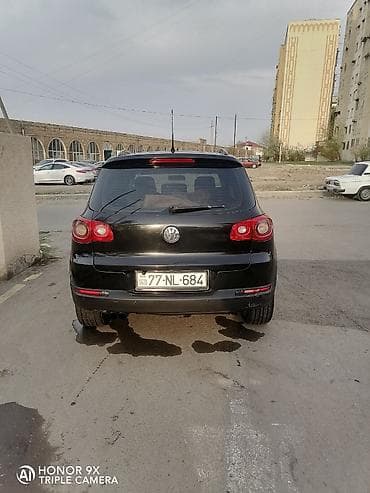 mercedes e 2: Volkswagen Tiguan: 2 l | 2009 il Ofrouder/SUV — 2