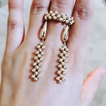 italyan qizili: Dəstə daxildir: Üzük, Sırğa, Pandora, Sarı qızıl, 585 Əyar, 517 g — 1