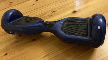 электросамокат в баку: Göy rəngli, iki təkərli, elektrikli hoverboard. Platformanın üzərində — 2