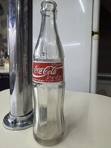 Məhsul: Şüşə Coca‑Cola butulkası Təsvir: - Həcm: 0.25 L (etiketdə — 6