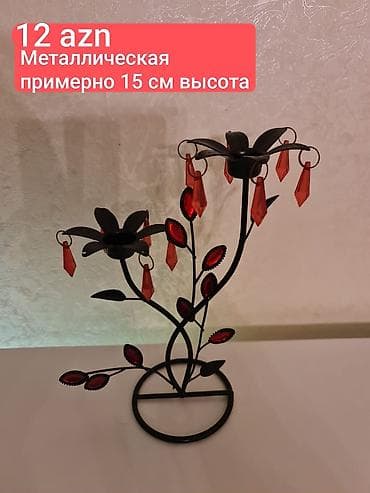Metal şamlıq – təxminən 15 sm hündürlükdə. Qara rəngli metal
