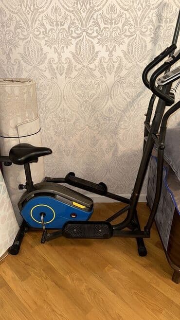 trenajor tutacaqları: Bu elliptik trenajor, bədənin yuxarı və aşağı hissəsini eyni vaxtda — 1