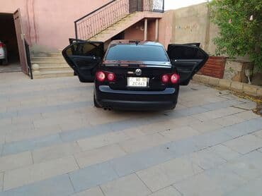 oturucu: Volkswagen Jetta: 2 l | 2009 il Sedan — 2