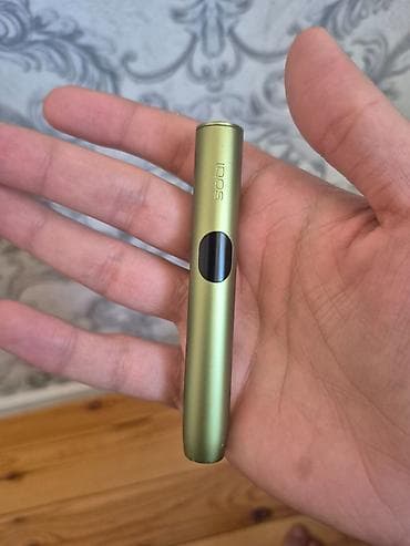 Məhsul: IQOS (yaşıl rəngdə) tütün isidən cihaz dəsti Təsvir: - — 3