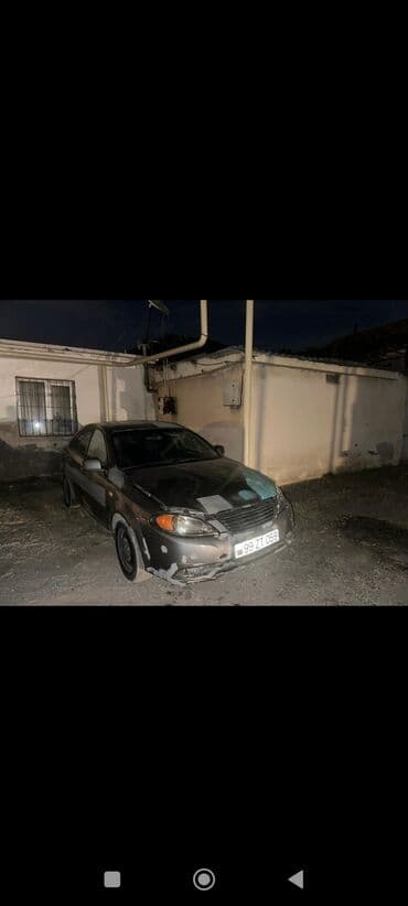 Ön tərəfində yüngül zədələri olan tünd rəngli Daewoo Gentra sedan lalafo.az -da Ön tərəfində yüngül zədələri olan tünd rəngli Daewoo Gentra sedan