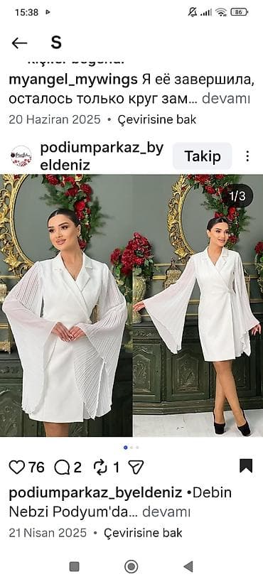 Ağ rəngli zərif qadın donu – “wrap” üslublu, yaxası şal formalı. Dizə