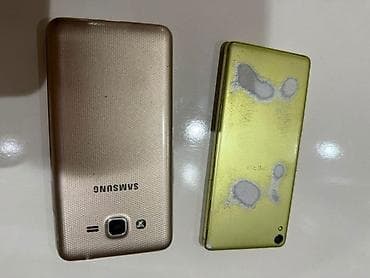 reqemsal kamera: İki ədəd mobil telefon dəsti. 1) Samsung DUOS (ağ/gözəl qızılı arxa — 1