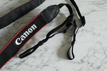 Fotoaparat kəməri boyuna asmaq üçün kəmər aparatın üzərində gələn