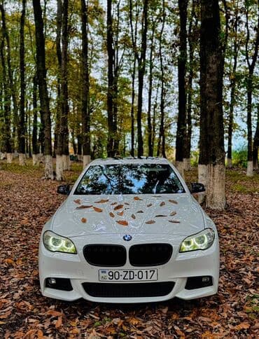 aston martin dbs 6 v12: BMW 5 series: 2 l | 2011 il Sedan — 1