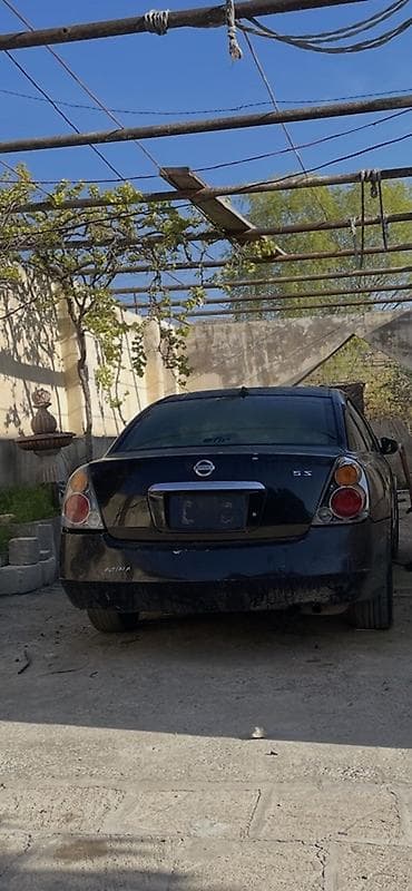 Nissan Altima: 2.5 l | 2005 il Sedan — 2