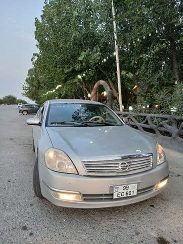 запчасти на фольксваген гольф 2: Gümüşü rəngli Nissan Teana avtomobili. Avtomobilin qabaq hissəsindəki — 8
