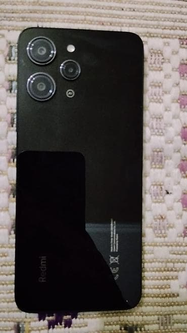 телефон fly с хорошим аккумулятором: Redmi 12, 128 ГБ, цвет - Черный, Отпечаток пальца — 2