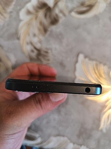 philips xenium 9@9h: Xiaomi Redmi smartfon - Arxa paneldə “Redmi” loqosu, kvadrat formalı — 3