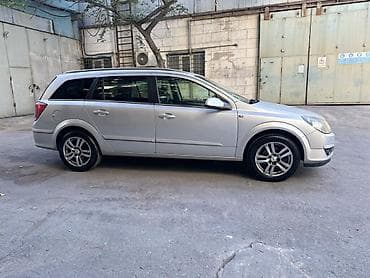 opel astra k: Opel Astra H Caravan (universal), gümüşü rəng. - Kuzov: 5 qapılı — 3