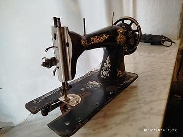 Məhsul: Singer tikiş maşını (mexaniki, əl ilə fırladılan çarxlı)