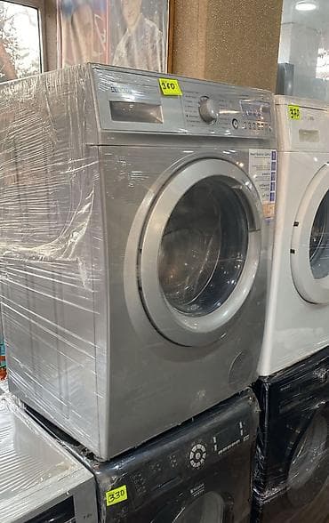 Краны водонагреватели: Gümüş rəngli önyükləməli paltaryuyan maşın - Geniş ön şüşə qapı və — 1