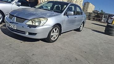ford focus hatchback: Mitsubishi Lancer: 1.6 l | 2006 il 466000 km Sedan — 6