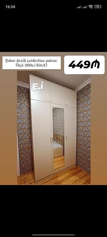 acilan divan: Ağ rəngli 3 qapılı dolab, orta qapıda tam ölçülü güzgü. Üst hissədə — 1