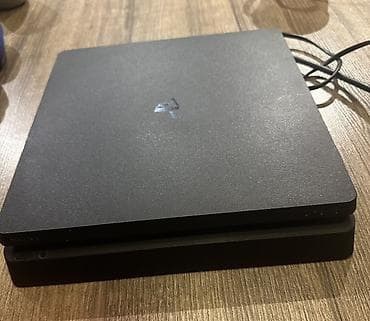 elektirik pilte: PlayStation 4 Slim konsol dəsti Paket tərkibi: - PS4 Slim (qara) - 3 — 2