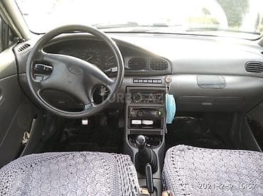 maşın satışı kredit: Kia Sephia sedan, gümüşü rəng. Kompakt ölçülü, şəhər üçün ideal 4 — 8