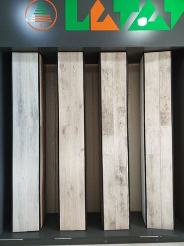 budda: Məhsul: Laminat döşəmə panelləri (ağac naxışlı) Təsvir: - Təbii ağac — 1